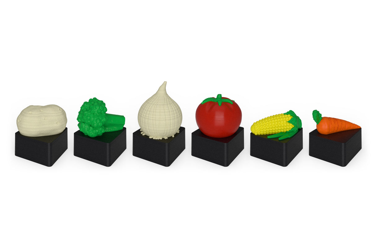 The six Veggie Pack keycaps in a row